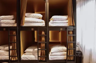 a closet filled with lots of beds and towels at Durty Nelly's Inn in Amsterdam