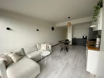 a living room with a couch and a table at Studio Amsterdam in Amsterdam