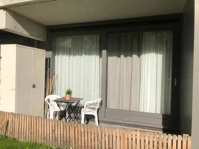 a patio with a table and chairs on a balcony at Studio Amsterdam in Amsterdam