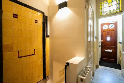 a bathroom with a walk in shower and a toilet at Nassau Canal Suites - in the heart of the city in Amsterdam