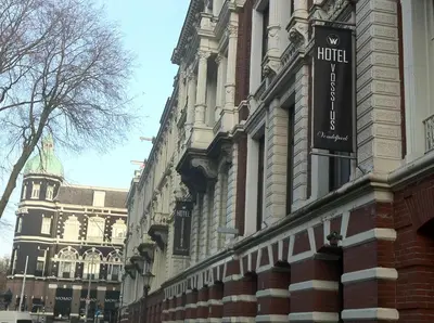 a building with a hotel sign on the side of it at Hotel Vossius Vondelpark in Amsterdam