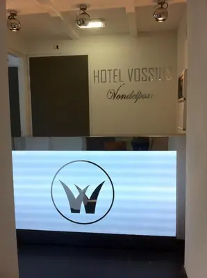 a sign for a hotel vassilis montreal at Hotel Vossius Vondelpark in Amsterdam