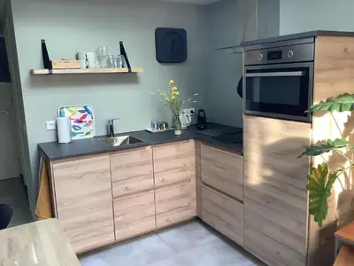 a kitchen with a sink and a microwave at Atelier Zonnehoek in Bergen