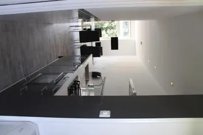 a bathroom with a black counter top in a room at Appartement De Zeester in Zandvoort