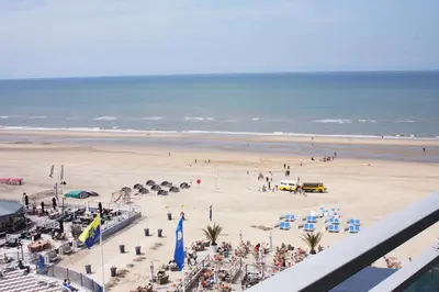 a view of a beach with a crowd of people at Studio at Sea in Zandvoort