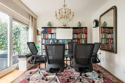 a room with four chairs and a table with a mirror at Cozy room in residential Alkmaar - Free parking in Alkmaar