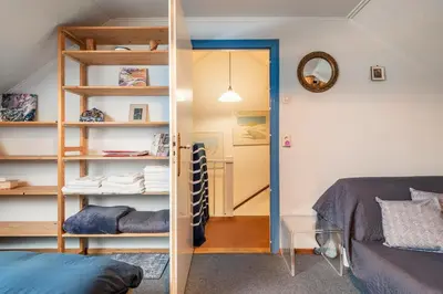 a bedroom with a bunk bed and a mirror at Cozy room in residential Alkmaar - Free parking in Alkmaar