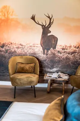 a living room with a deer mural on the wall at de Vogelensangh in Vogelenzang