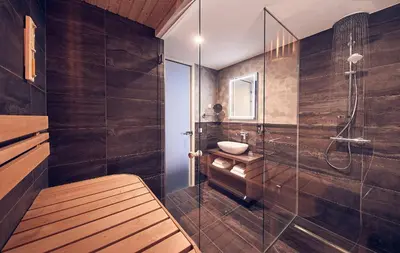 a bathroom with a glass shower and a sink at Inntel Hotels Utrecht Centre in Utrecht