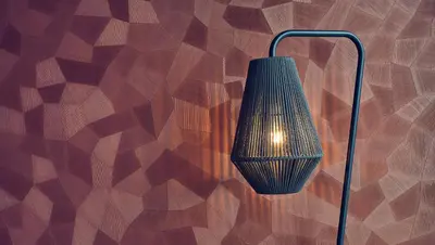 a lamp hanging on a wooden wall at Inntel Hotels Utrecht Centre in Utrecht