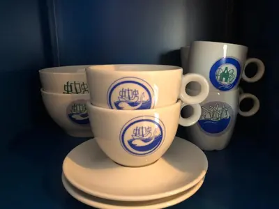 three coffee cups sitting on saucers on a table at Het Pulletje in Westzaan