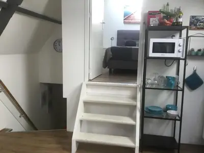 a white ladder with a microwave on it in a room at Appartementen Purmerend A in Purmerend