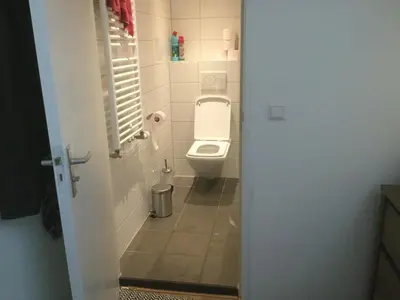 a bathroom with a toilet in a stall at Appartementen Purmerend A in Purmerend