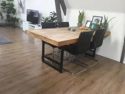 a dining room table with black chairs around it at Appartementen Purmerend A in Purmerend