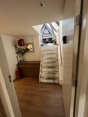 a stairway leading up to a staircase in a room at Appartementen Purmerend A in Purmerend