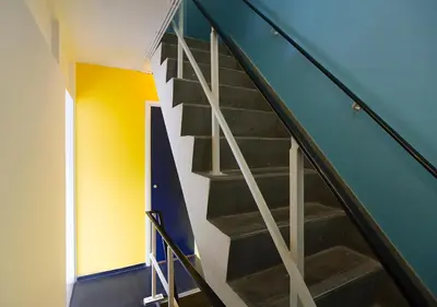 a staircase in a house with a blue wall at SWEETS - Gerben Wagenaarbrug in Amsterdam