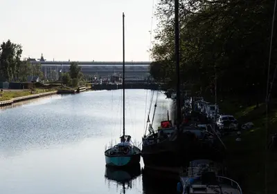 a group of boats are docked in the water at SWEETS - Gerben Wagenaarbrug in Amsterdam
