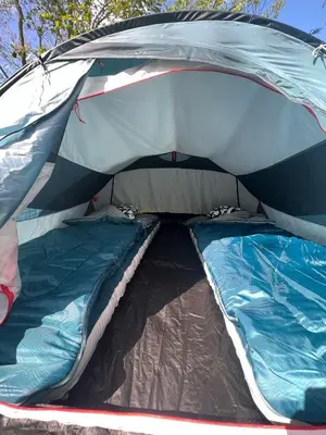 a tent with the door open with a mattress in it at The ESN Kingsday Campsite in Amsterdam