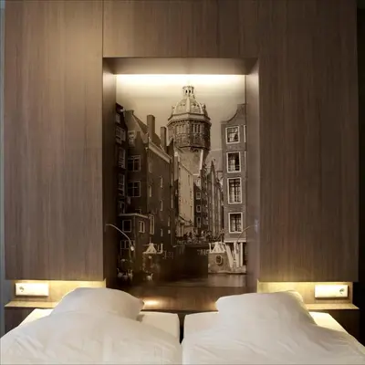 a bedroom with a picture of a city at Skotel Amsterdam, Hotelschool The Hague in Amsterdam