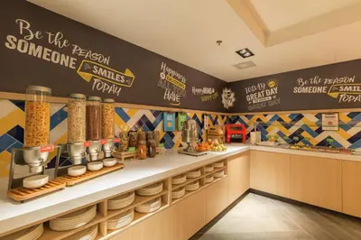 a restaurant with a counter with some food on it at Hampton By Hilton Utrecht Centraal Station in Utrecht