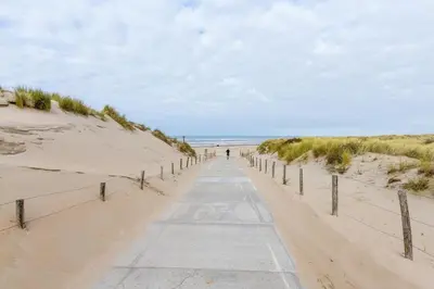 a path through the sand on the beach at Beachhouse Bosweg in Noordwijk aan Zee