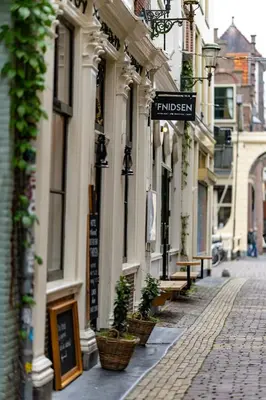 a street with a street sign on a building at Hotel 't Fnidsen in Alkmaar