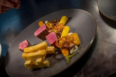 a plate with different types of food on a table at Hotel 't Fnidsen in Alkmaar