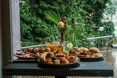 a table with two plates of food on it at Grand Hotel Downtown in Amsterdam