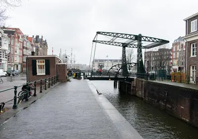 a bridge over a river in a city at SWEETS - Scharrebiersluis in Amsterdam