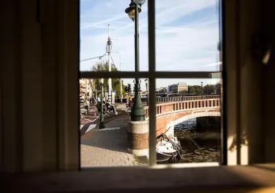 a view of a bridge from a window at SWEETS - Nieuwe Amstelbrug in Amsterdam