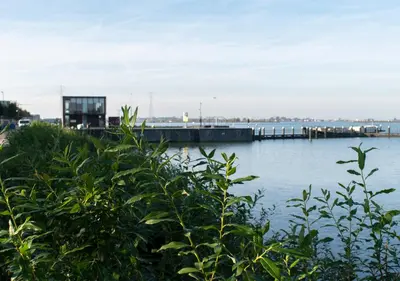 a view of a body of water with a pier at SWEETS - Sluis Haveneiland in Amsterdam