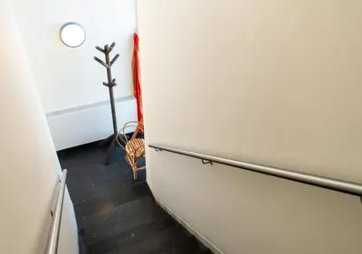 a white refrigerator in a room with a floor at SWEETS - Sluis Haveneiland in Amsterdam