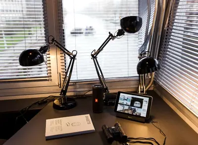 a desk with two lamps and a tablet on it at SWEETS - Wiegbrug in Amsterdam