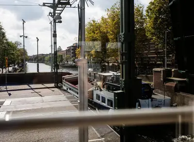 a boat is docked in a marina at SWEETS - Kinkerbrug in Amsterdam