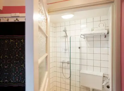 a bathroom with a shower and a toilet at SWEETS - Kinkerbrug in Amsterdam