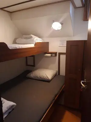 a small room with two bunk beds in it at Felicitas in Amsterdam