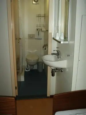 a small bathroom with a toilet and a sink at Felicitas in Amsterdam