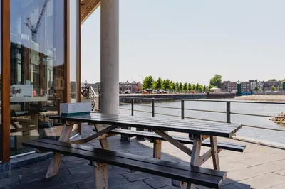a wooden picnic table sitting on top of a building at Hotel Pontsteiger in Amsterdam