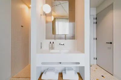 a bathroom with a sink and a mirror at Hotel Pontsteiger in Amsterdam