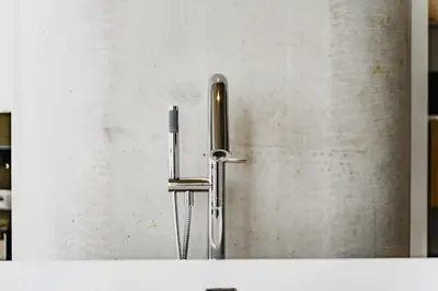 a stainless steel refrigerator with a water hose at Hotel Pontsteiger in Amsterdam