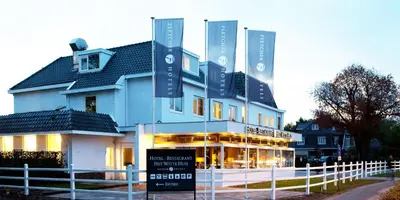 a building with a sign in front of it at Fletcher Hotel-Restaurant Het Witte Huis in Amersfoort