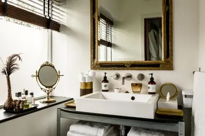 a bathroom with a sink and a mirror at B&B Habitat in Beverwijk