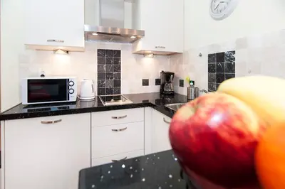 an apple on a counter in a kitchen at B&B Canaliscious in Amsterdam