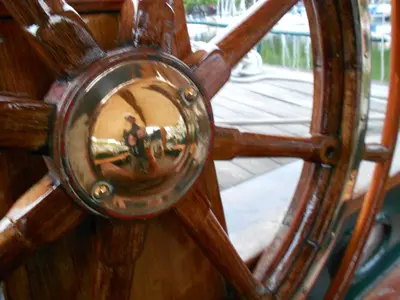 a close up of a wooden door with a mirror at Tjalkjacht Pelikaan Volendam in Volendam