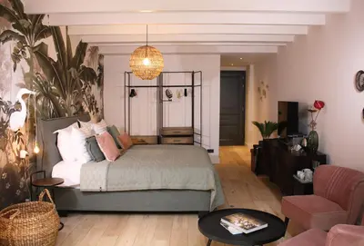 a bedroom with a bed and a living room at Villa360 in Amsterdam