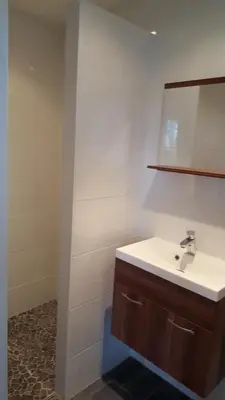 a bathroom with a sink and a mirror at Chalet in Castricum