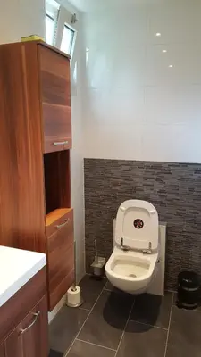 a bathroom with a toilet and a sink at Chalet in Castricum