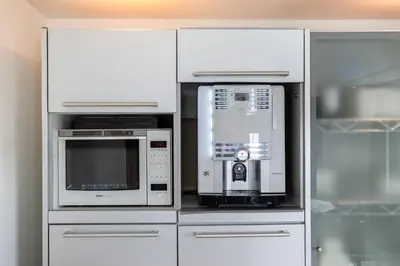 a kitchen with two microwaves and a microwave at Casa Grande - cityview Amsterdam in Landsmeer