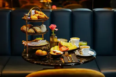 a tray of food on a table with breakfast foods at SUPPER Hotel in Amsterdam