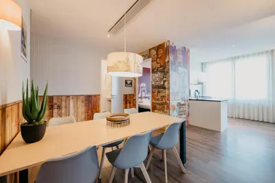a kitchen and dining room with a table and chairs at Amsterdam ID Aparthotel in Amsterdam